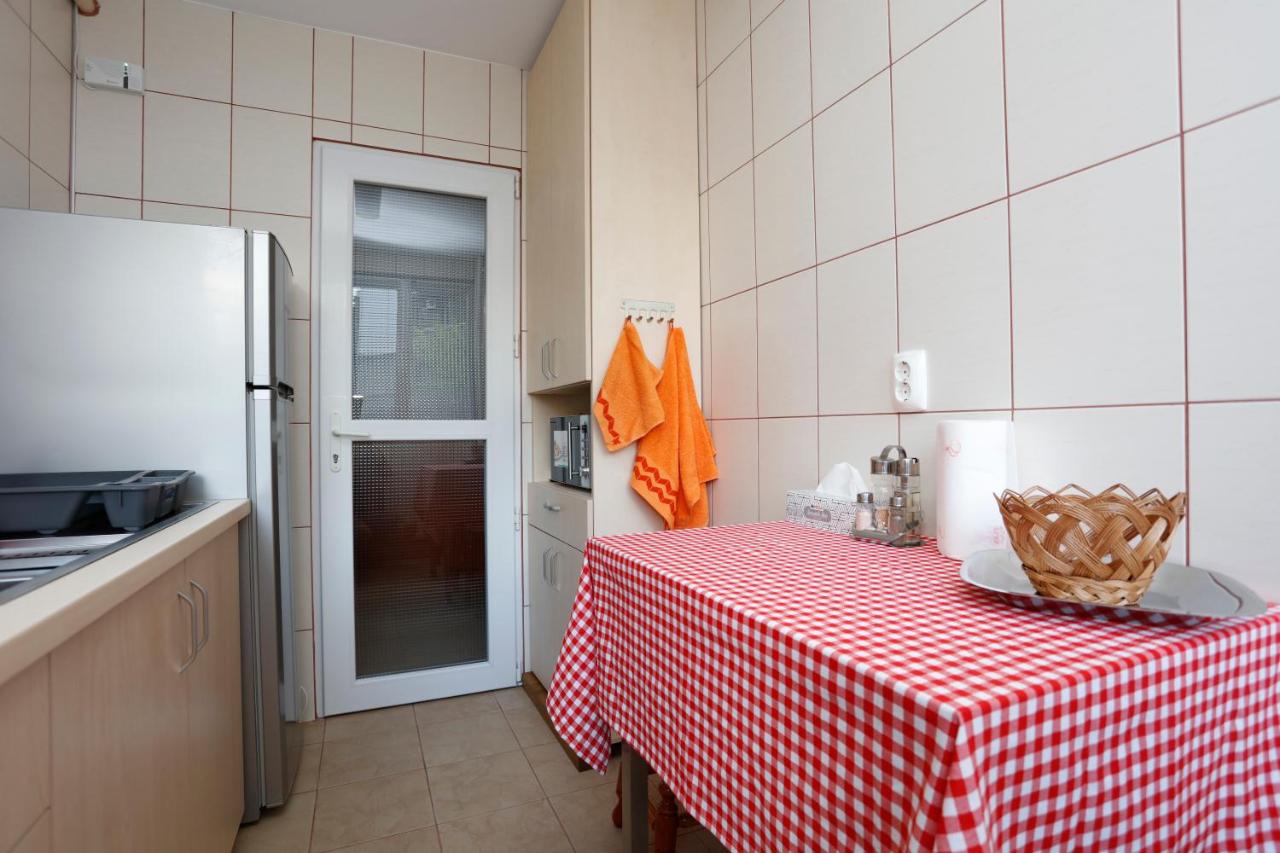The kitchen, with fridge and the door to the balcony