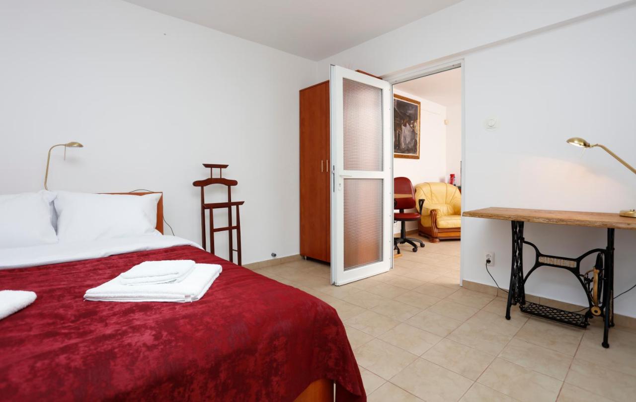 The bedroom, with the glass door open to the living room